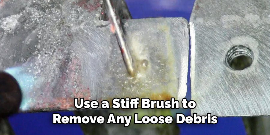 Use a Stiff Brush to Remove Any Loose Debris